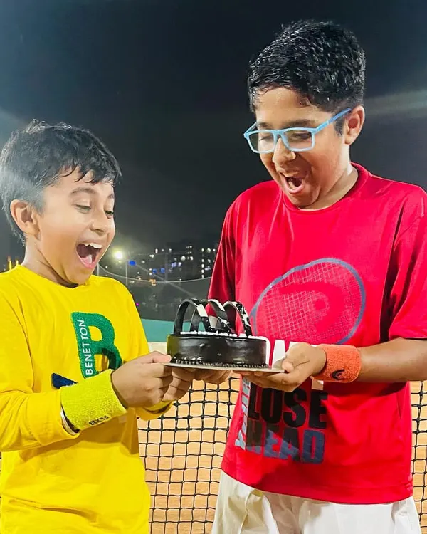 This picture says it all. The excitement and joy of celebrating a tournament victory with friends and a well-deserved cake. These are the moments we cherish.