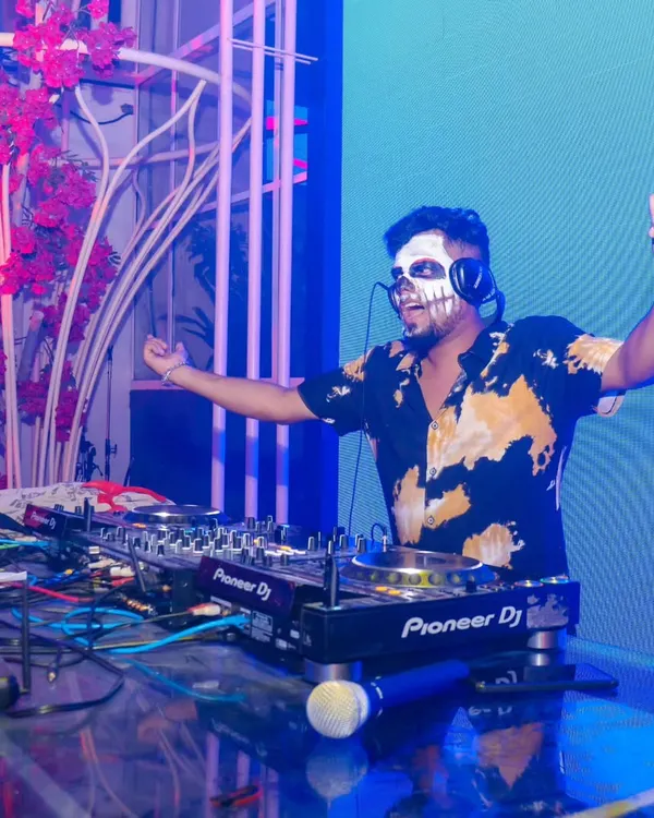 I love bringing a unique vibe to themed events like this Halloween party. Here I am, in full costume, getting the crowd hyped with a spooky season set.