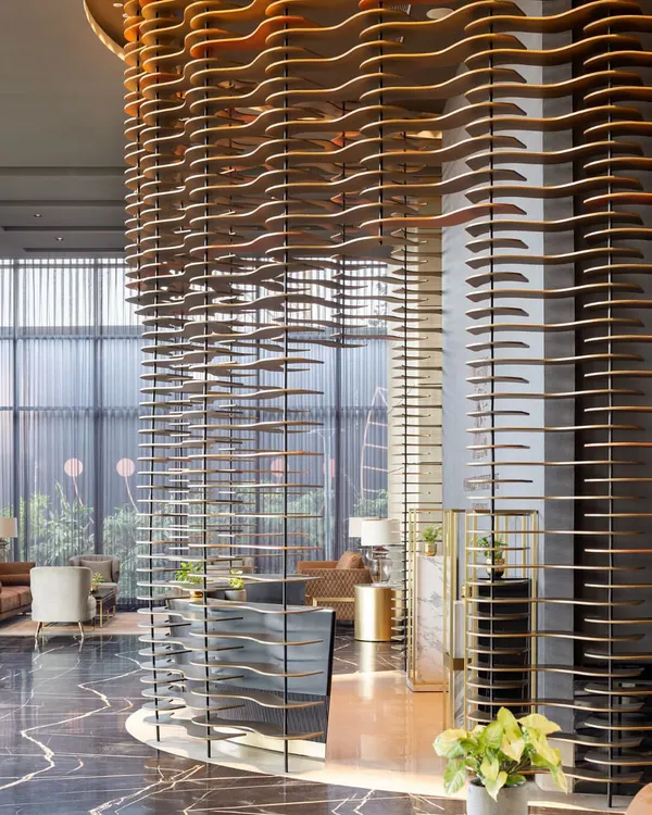 The dramatic, wave-like modular facade at the Godrej South Estate Experience Centre in Okhla. This sculptural installation serves as the reception backdrop, creating an unforgettable first impression.