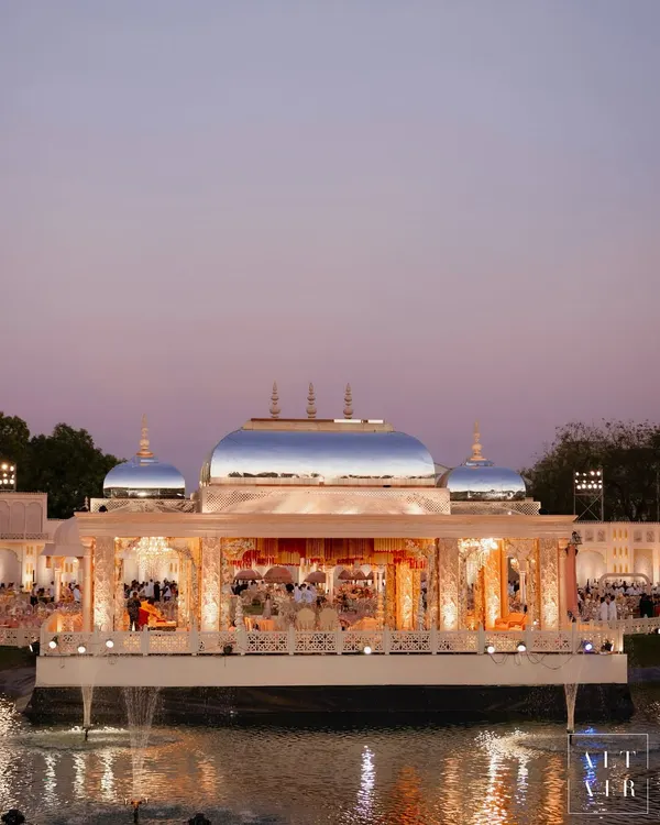 This is the kind of magic I live to create. A floating mandap at dusk, reflecting the sky's gentle colors, designed as a serene, sacred space for Jeet and Diva to begin their journey together at their Saanjh Niwas wedding.