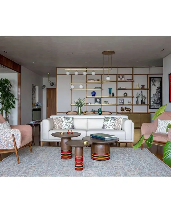 The main living area of Ikigai House, showing the interplay of different seating arrangements, custom furniture, and art. The space is designed for both large gatherings and quiet family moments.