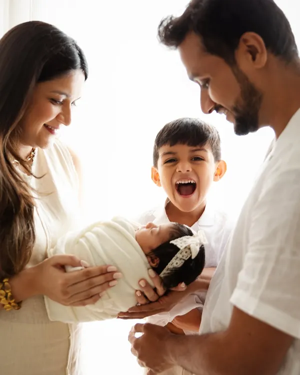 The pure excitement of a big brother welcoming his baby sister. I aim to capture the real emotions of your family's story, creating authentic portraits filled with love and personality.