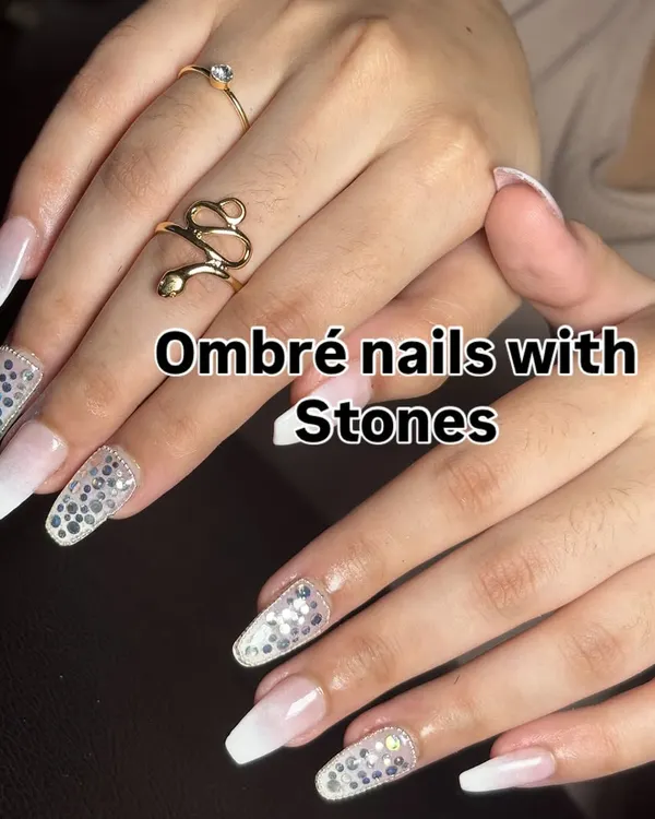 A stunning choice for the modern bride. This set features a soft white ombré fade on long coffin nails, with accent nails fully covered in sparkling silver stones for maximum glamour.