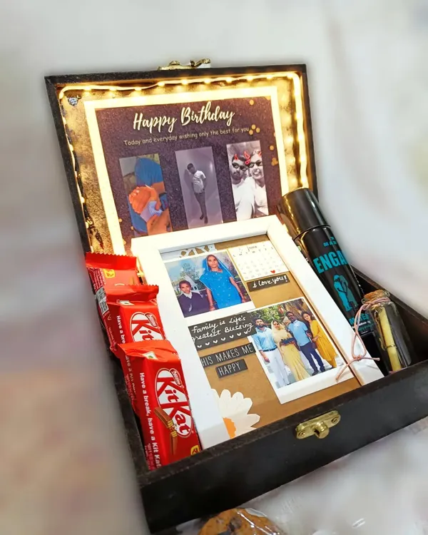 A look inside my "Black Vintage Hamper for Him." This light-up box includes a custom photo collage, deodorant, chocolates, and a message in a bottle, making it a complete birthday package.