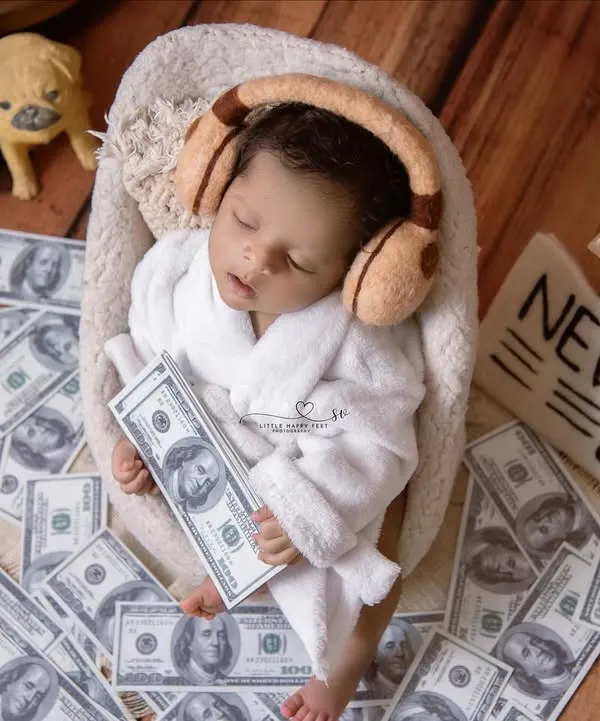 This little boss baby is already taking over, surrounded by money, music, and the morning news. It's a hilarious and adorable theme that always gets a great reaction.