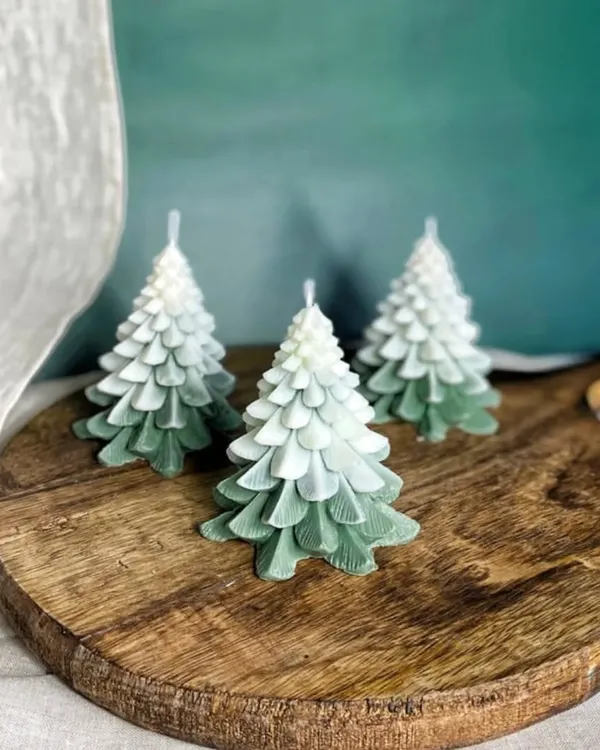 My ombre green Christmas tree candles are a beautiful addition to any holiday decor. They are hand-poured with soy wax and look stunning on a wooden board.