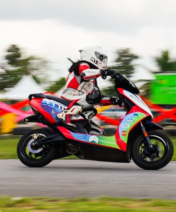 A rider leans an Ather 450X electric scooter into a corner during India's first EV racing festival, held right here at Aruani Grid. We are at the forefront of the electric racing revolution.