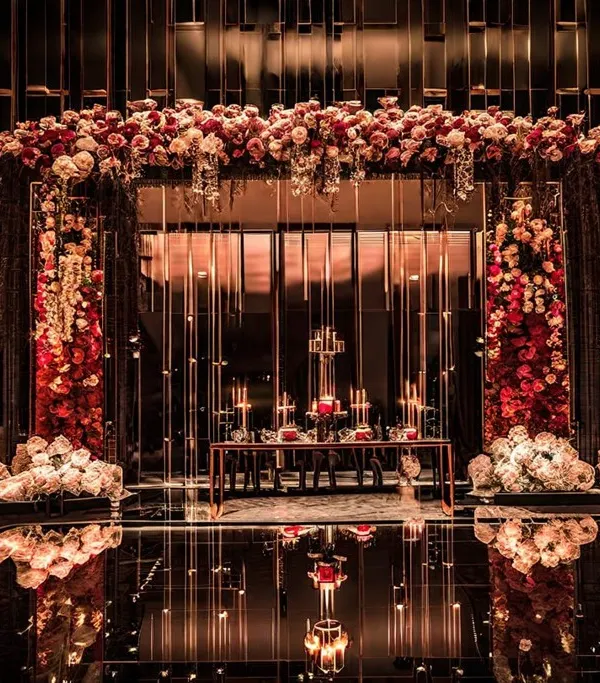 This is the magic I create. A breathtaking reception where romance is reflected in every detail, from the cascading floral arch to the warm glow of candlelight, setting the stage for a truly unforgettable evening.