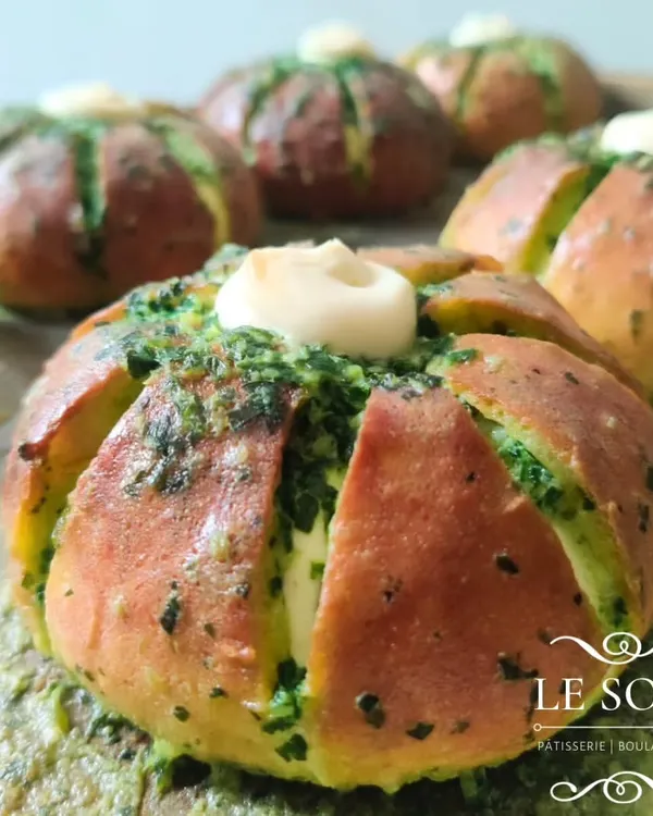 This is my absolute bestseller, the Korean Cream Cheese Garlic Bun. It's a soft, eggless bun loaded with cream cheese, then dunked in a savory garlic and herb glaze. It's the perfect savory treat.