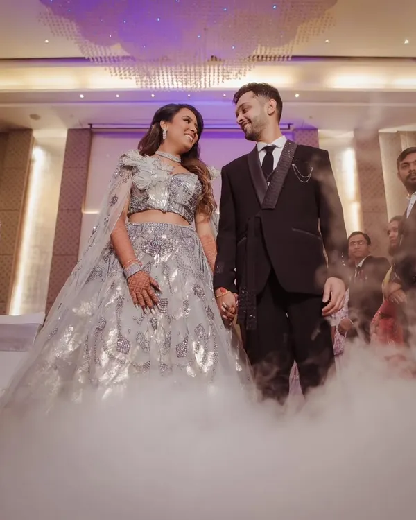 A fairytale moment for the couple during their reception. We used a low-lying fog effect to create this dreamy, 'dancing on clouds' look for their entrance.