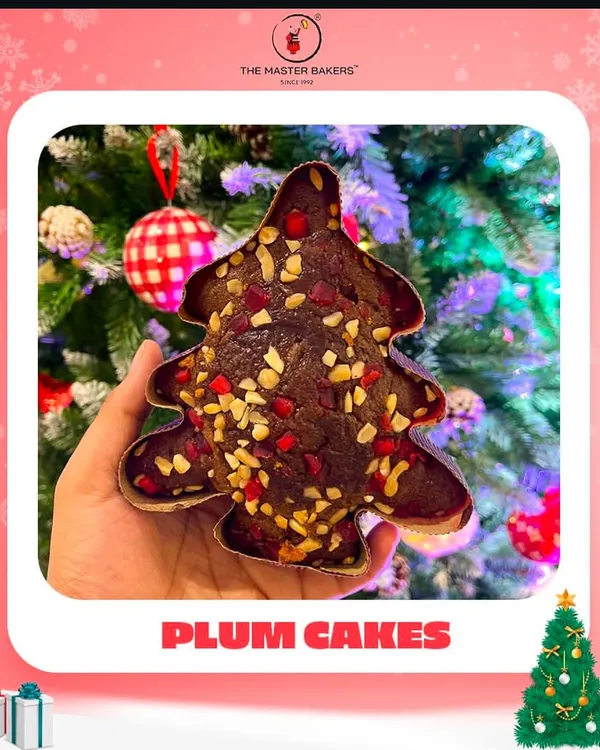 The holiday season isn't complete without the taste of a classic plum cake. Our Christmas tree-shaped plum cake, rich with fruits and nuts, is a festive favorite that brings the magic of the season to your dessert table.