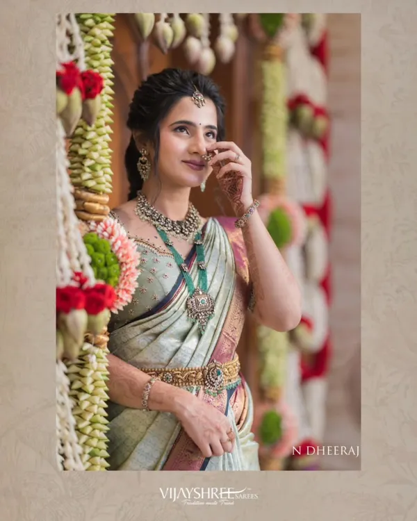 Our client Ranjitha, the epitome of grace in a pastel Kanjivaram tissue saree. The soft finish and subtle sheen of the fabric make it a perfect choice for elegant daytime events.