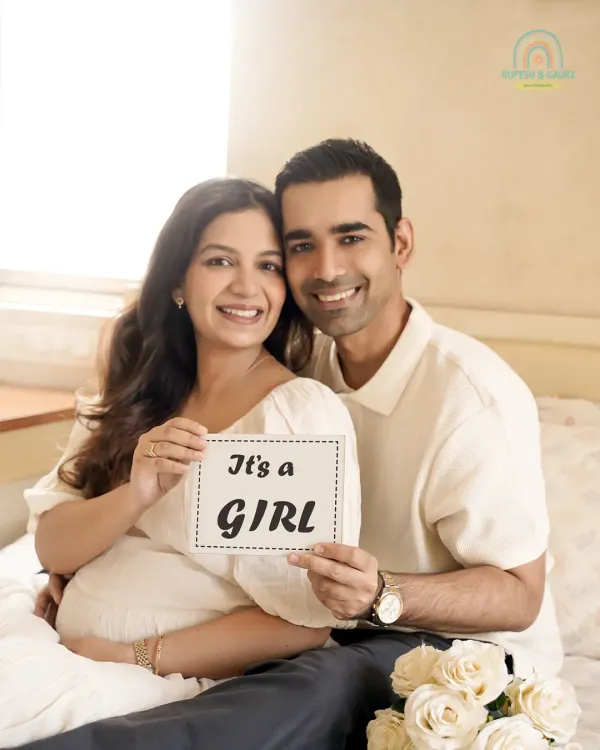 A joyful announcement from the comfort of their home. Using simple props like this "It's a Girl" sign, we capture the excitement of the big reveal in a personal and intimate setting.