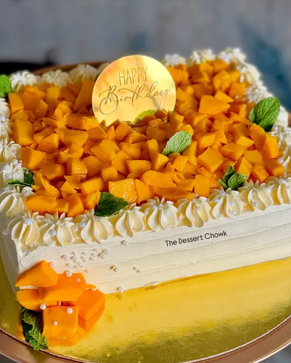 My seasonal bestseller, the Mango Maharaja cake. This square cake is loaded with fresh, juicy Alphonso mango chunks, making it the ultimate summer treat.