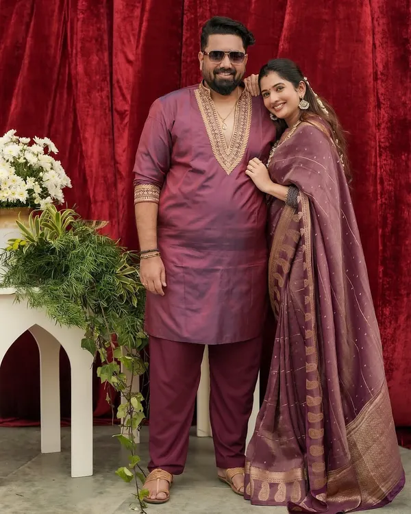 A beautiful portrait of director Tharun Sudhir and actress Sonal Monteiro. I designed his custom kurta in a deep wine color with intricate gold embroidery around the neck, perfectly complementing her matching saree for a coordinated, elegant look.