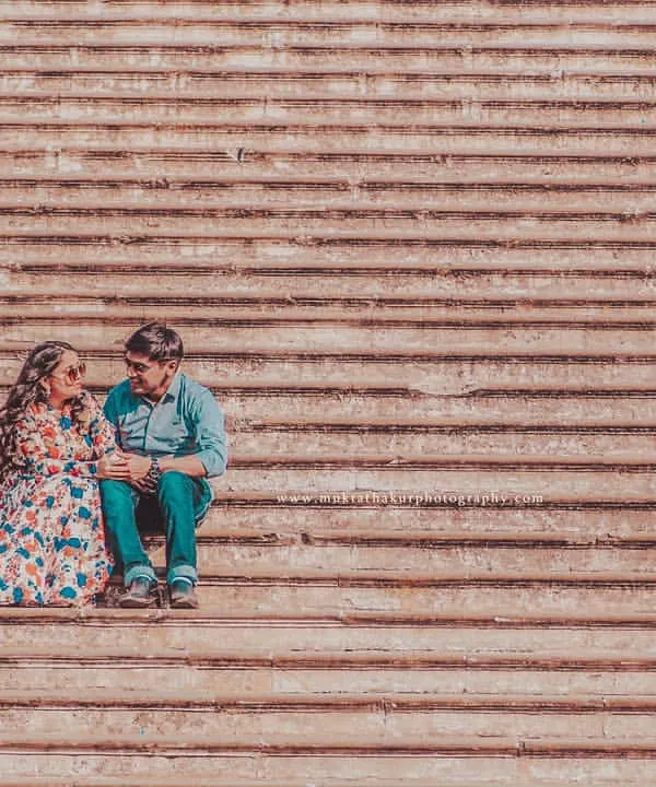 Using the architectural lines of these steps to frame a quiet moment. This wide shot shows how we can turn any location into a beautiful backdrop for your pre-wedding photoshoot.
