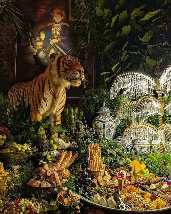 For the 25th anniversary of Sabyasachi, we helped create this spectacular grazing table, turning it into a maximalist forest scene. We surrounded a magnificent tiger statue with dense foliage, crystal palm lamps, and antique vases, crafting an opulent, unforgettable experience that perfectly matched the grandeur of the occasion.