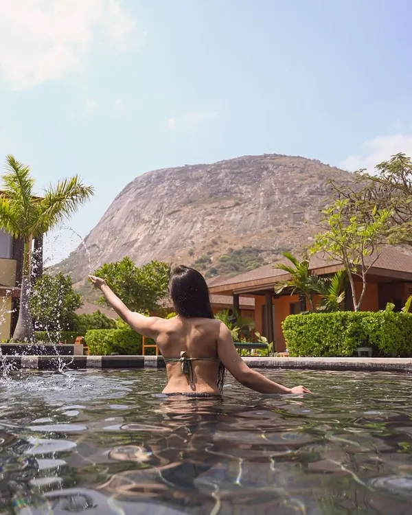 This is your moment to pause. Imagine yourself here, enveloped by the calm waters of our pool, with the majestic Nandi Hills standing guard. We have crafted this sanctuary for your ultimate relaxation and rejuvenation.