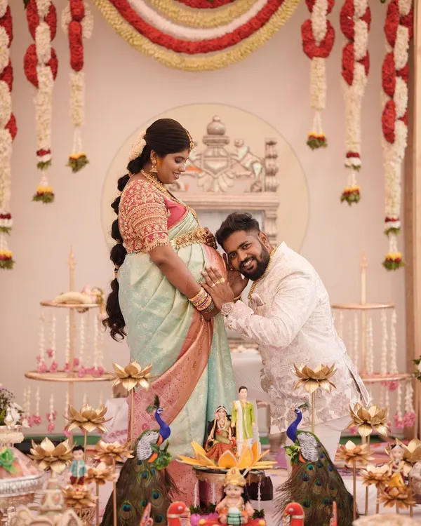 A heartwarming moment from a client's baby shower (seemantha). The couple looks so happy, and her pastel saree is the perfect choice for this beautiful occasion.