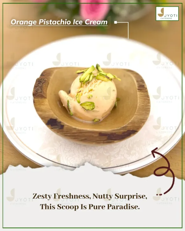 A scoop of pure paradise. This Orange Pistachio Ice Cream combines zesty freshness with a nutty surprise, served in a beautiful wooden bowl.