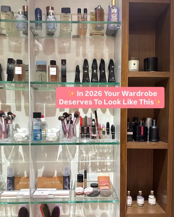 Your vanity area should inspire you every morning. We organized this client's collection of perfumes, makeup, and brushes on clear glass shelves with integrated lighting, creating a clean and glamorous beauty station.