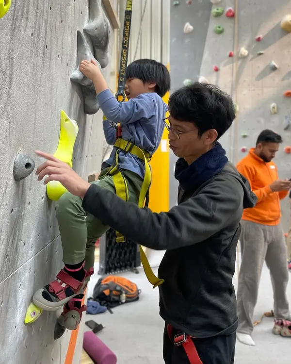 A father and son get ready for their first climb together. Our instructors are always on hand to provide one on one guidance and ensure everyone feels comfortable and ready for their climbing session.