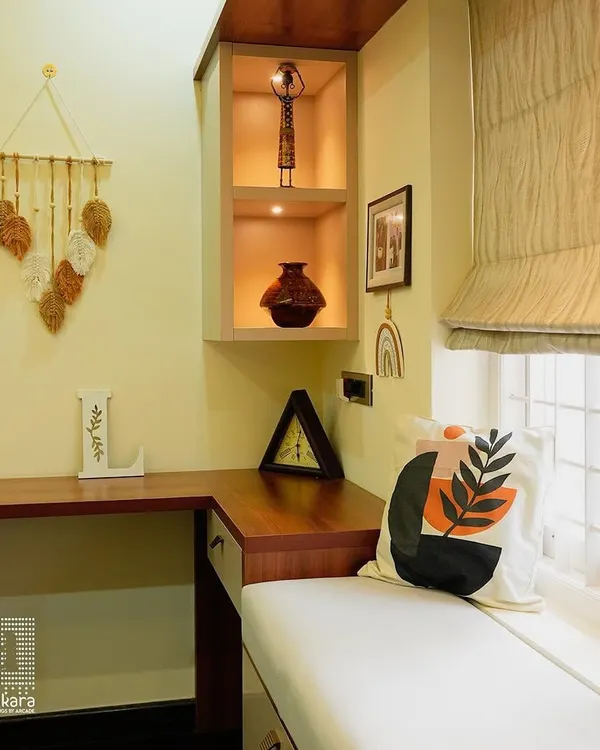 A close-up of a cozy window seat nook, featuring custom-fitted Roman blinds that offer a clean, tailored look while providing excellent light control.