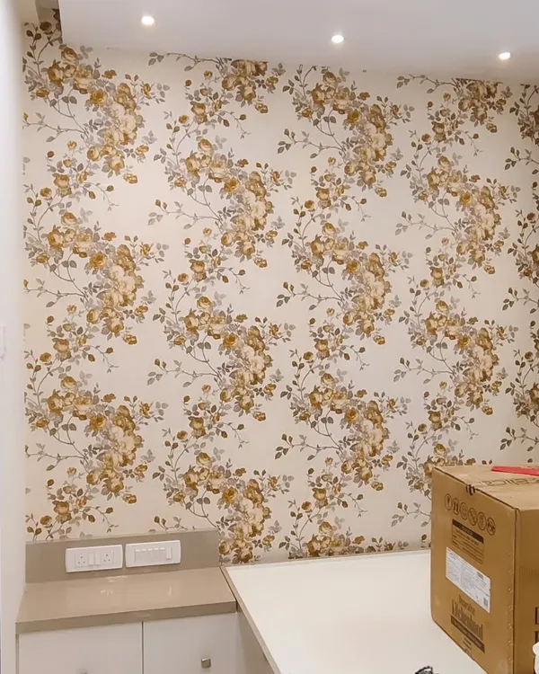 A classic floral wallpaper adds timeless charm to this wall. I ensure the pattern repeats seamlessly and make precise cutouts for electrical outlets.