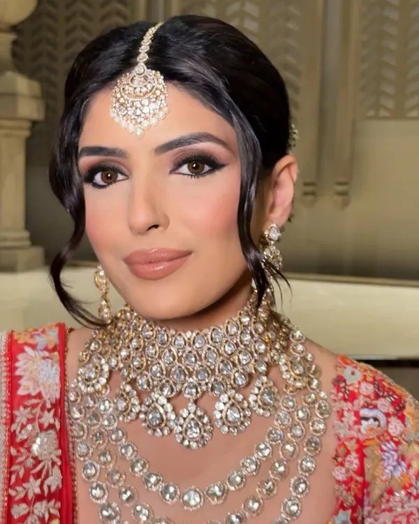 This is the look I live for. It's a blend of classic elegance and modern confidence, featuring a defined smokey eye and a soft nude lip that enhances her natural beauty. The goal is always to create a flawless, radiant base that looks stunning both in person and on camera.