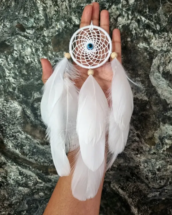 Minimalist vibes, maximum charm. This small white evil eye dreamcatcher is the perfect piece of art for your car, customized with love for our client.