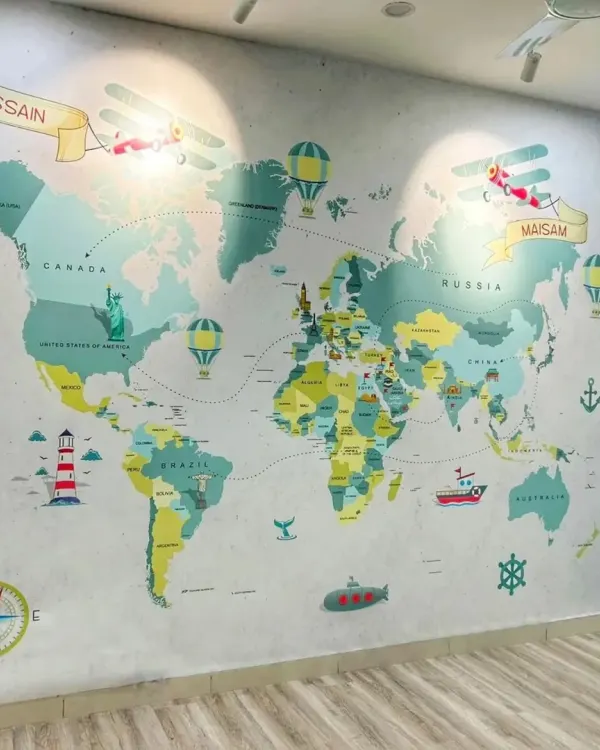 For this child's room, I paired a light wood floor with a custom world map wallpaper. The durable, easy-to-clean floor is perfect for a playroom, while the overall design sparks imagination and adventure.