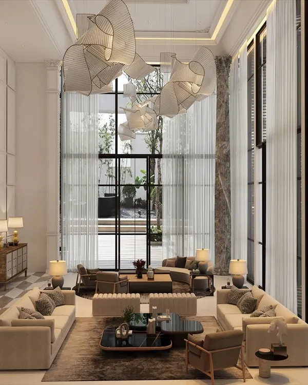 This double-height living room is designed to be both grand and inviting. By using classical wainscoting, a sculptural marble column, and an abstract chandelier, I created a space that feels open, elegant, and filled with natural light, perfect for modern family life.