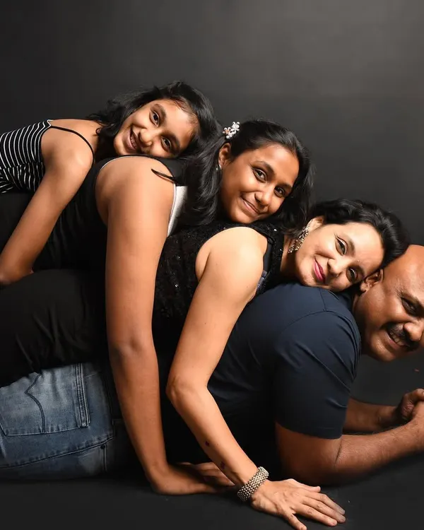 A family is a little bit of crazy and a whole lot of love! This fun pose shows the playful and loving connection between everyone. I love creating dynamic family portraits that show your family's true personality.