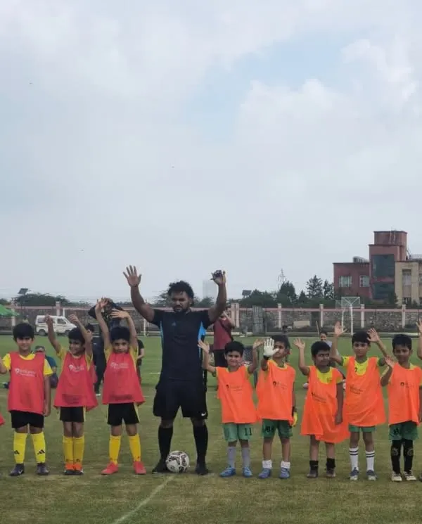 Another one of our talented youth teams, hands up and full of energy before their league match. The excitement and camaraderie are contagious.