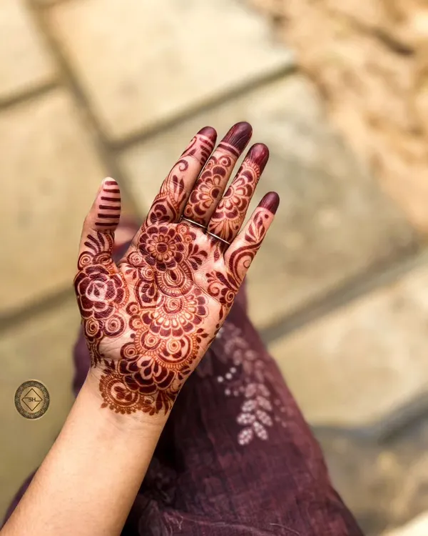 This is the beautiful, rich red-brown stain from my natural henna paste about 24 hours after application. This intricate floral design on the palm shows how well the color develops.