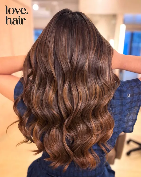 A perfect example of a rich, non-bleach brunette color. We added subtle dimension to this client's hair, finishing with soft waves to catch the light and show off the healthy shine.
