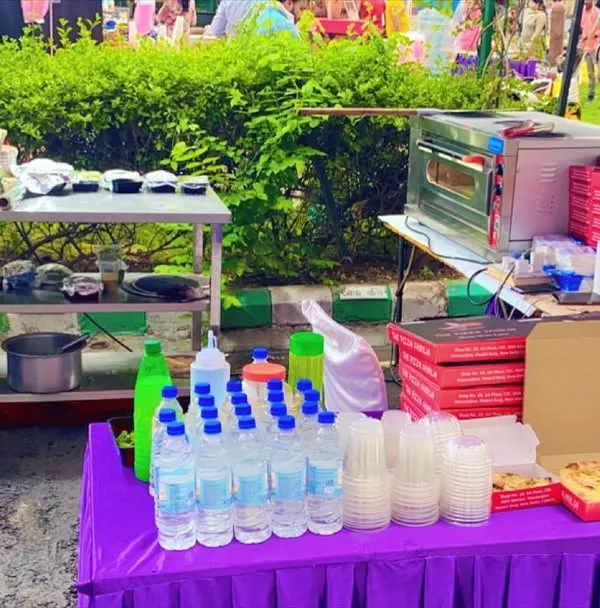 This was my live food setup for a Saturday night event at Carlton Estates. You can see the pizza oven, prep station, and serving area, all organized for efficient service in an outdoor park setting.