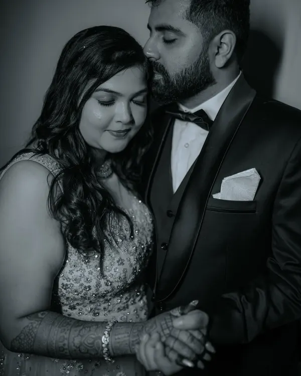 A timeless black and white portrait from a sangeet night. This intimate shot captures the elegance and deep affection between the couple amidst the celebration.