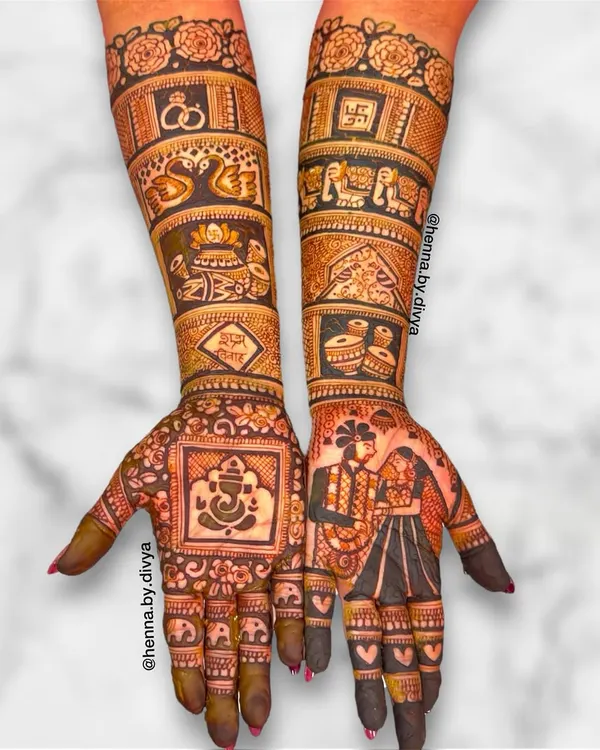 This full bridal design is a perfect example of storytelling, with a detailed couple portrait on one palm and a Ganesha figure on the other for blessings. The arms are filled with traditional wedding symbols like dhol, shehnai, and elephants.
