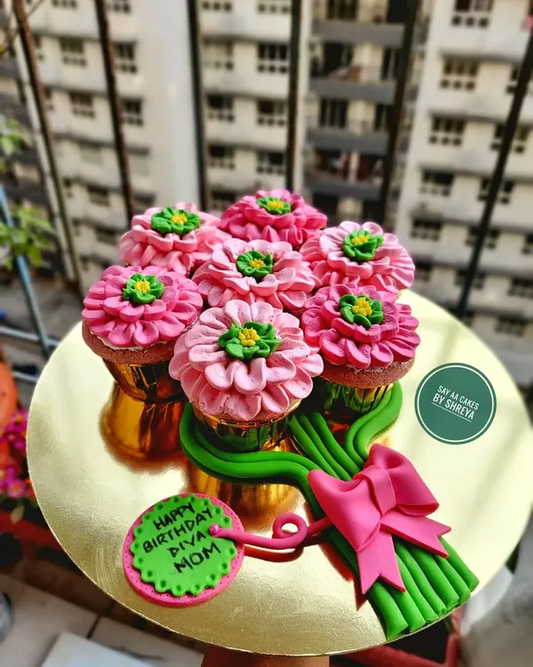This cupcake bouquet is the perfect way to combine the beauty of flowers with the deliciousness of fresh-baked cupcakes. Each flower is hand-piped with frosting, creating a unique and edible gift for birthdays, anniversaries, or just to make someone's day.