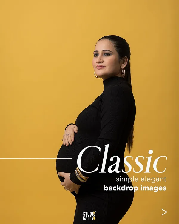 A classic, elegant maternity portrait against a bold yellow backdrop. This style is perfect for creating a timeless and striking image that focuses on the beauty of your silhouette.