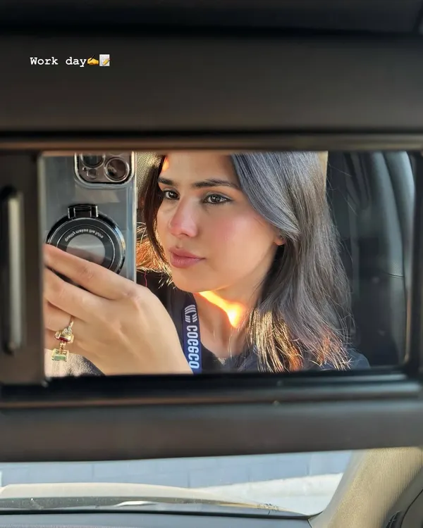 A car mirror selfie from a workday, the first slide of my June photo dump.