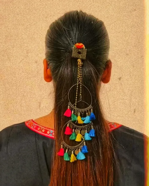 Beyond bags, I also love creating other unique accessories. This is a handcrafted hair accessory with colorful tassels, designed to add a fun, bohemian flair to a simple ponytail or braid for a festive occasion.