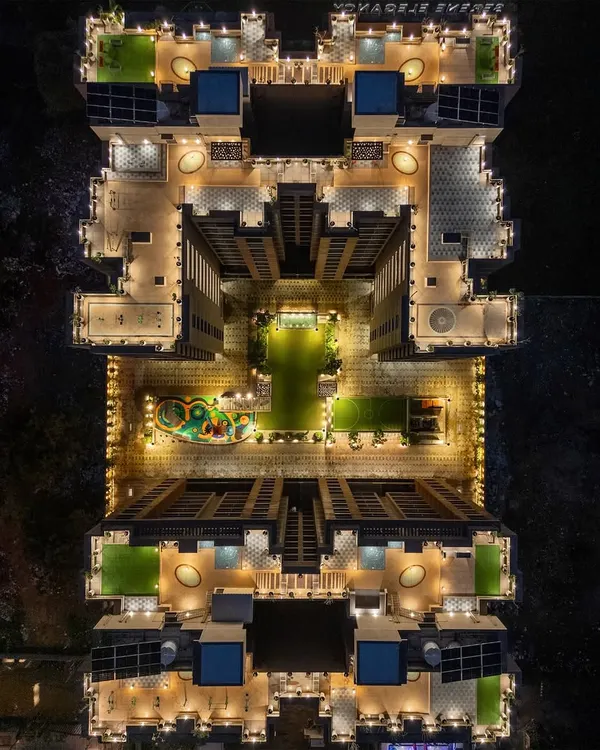 This aerial view of our PIXELSCAPES project at night reveals the master plan in its entirety. We use landscape lighting not just for visibility, but to sculpt the environment, creating a vibrant, secure, and welcoming community hub that feels alive long after sunset.