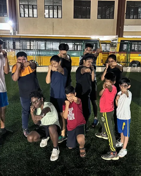 Our young fighters from the Boxing Summer Camp posing in their boxing stance. We focus on making fitness fun while teaching valuable self-defense skills.