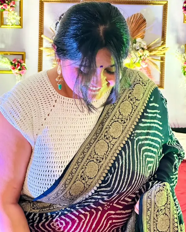 This photo shows my mom looking radiant in a custom crochet blouse I made for her. It's a simple, elegant design that pairs beautifully with a traditional saree.