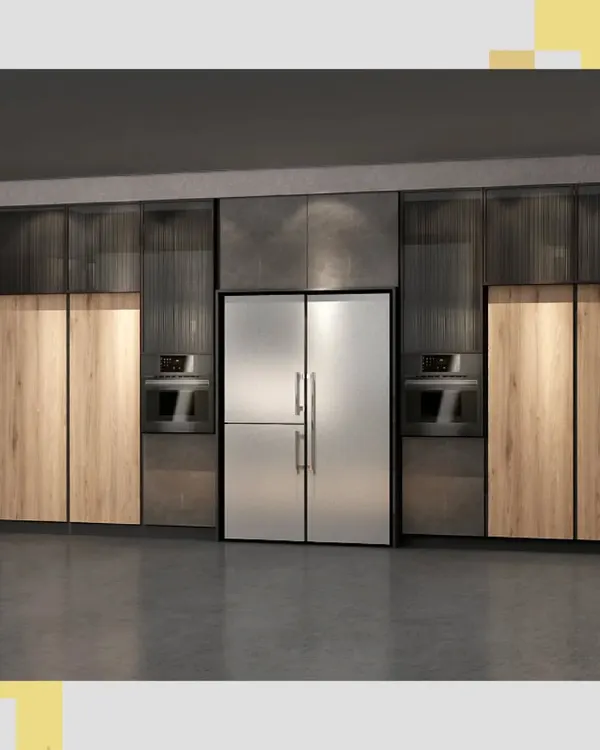 This is how we achieve a seamless and integrated kitchen design. The full-height cabinetry conceals appliances and storage, blending wood grain textures with modern fluted glass and a statement stainless steel refrigerator for a clean, uncluttered look.