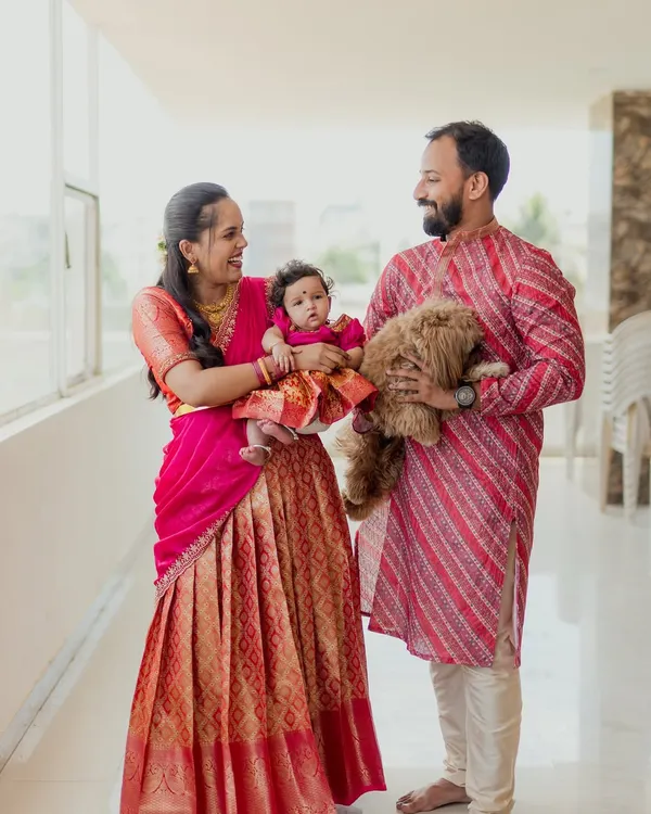 A heartwarming family portrait that truly includes everyone. The way this family holds their newborn and their beloved dog shows the love that fills their home.