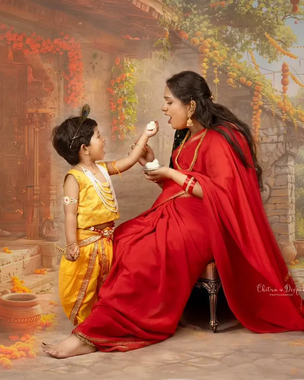 A beautiful recreation of the classic Yashoda and Krishna story, showing a mother and her son in a themed setting, capturing a tender, artistic moment.