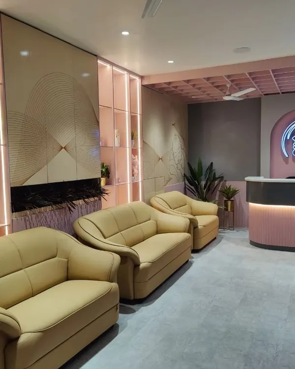 The reception and waiting area of the Life Care Clinic, where we balanced comfort and functionality. The design features soft pink tones, comfortable seating, and a branded reception desk to create a welcoming and calming first impression for patients.
